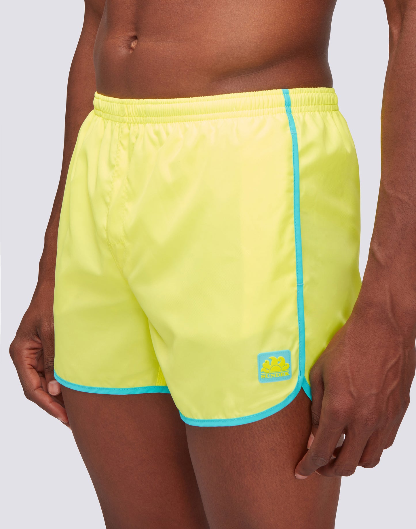 SHORT SWIMSHORTS WITH ELASTIC WAIST AND ROUND SIDE SLITS