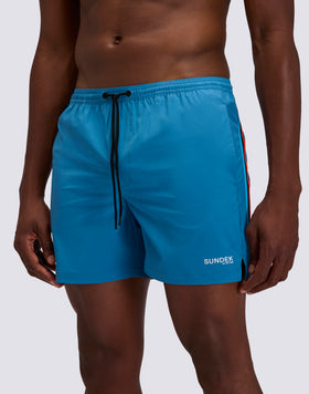 BAÑADOR CON TEJIDO ELÁSTICO, CINTURA ELÁSTICA Y BOLSILLO EXTRAÍBLE