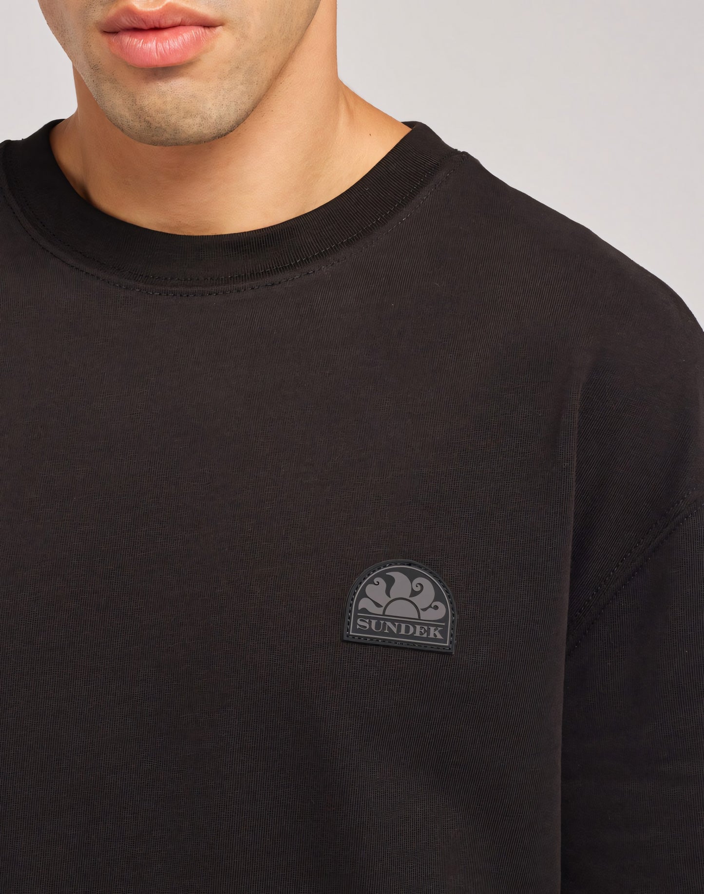 T-SHIRT WITH RUBBER PATCH